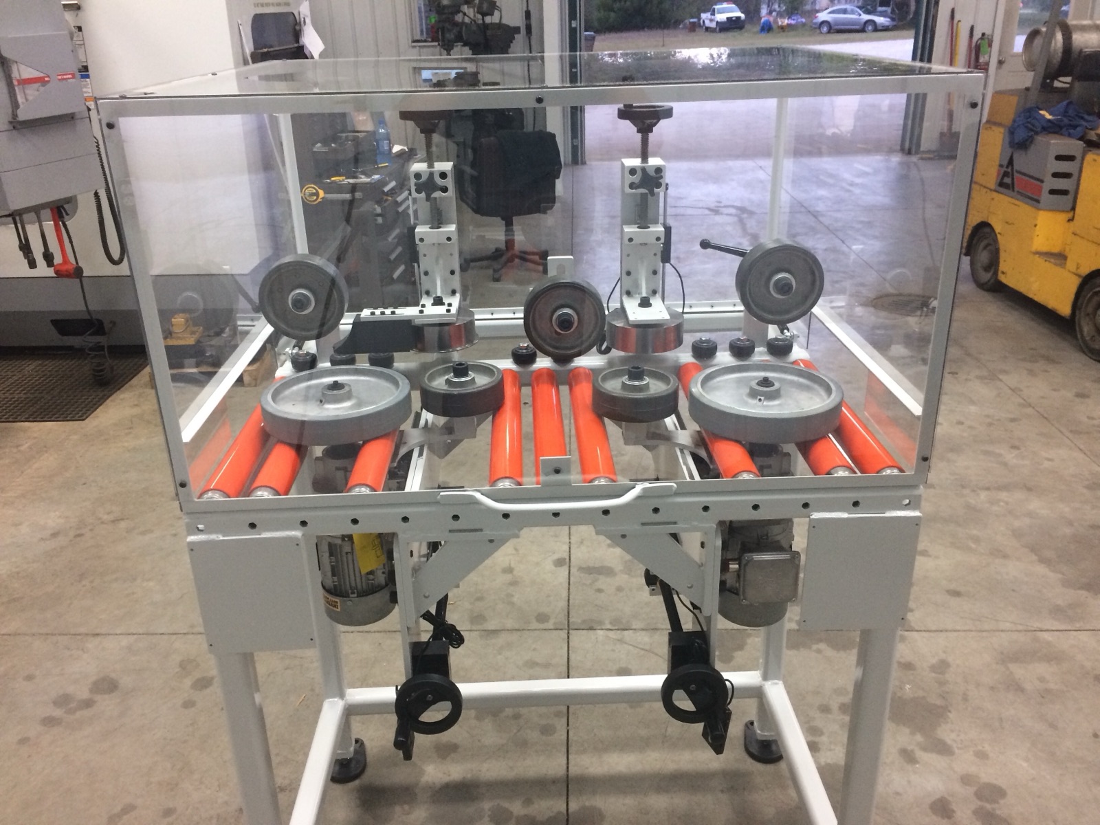 Roller conveyor section with polyurethane rollers and clear machine guarding